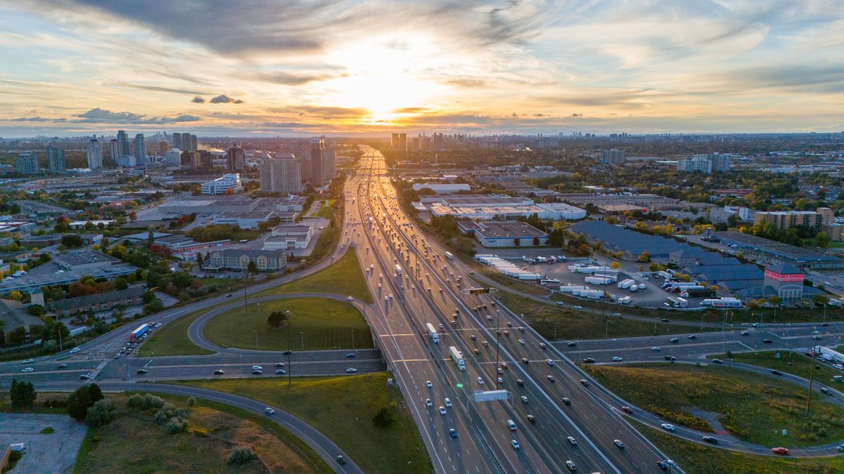 Fastest way from Pearson Airport to downtown Toronto by car on the highway at sunset